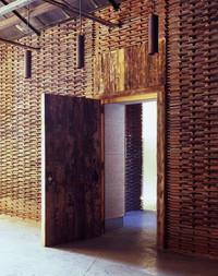 Walls made out of reclaimed roof tiles in Arturo